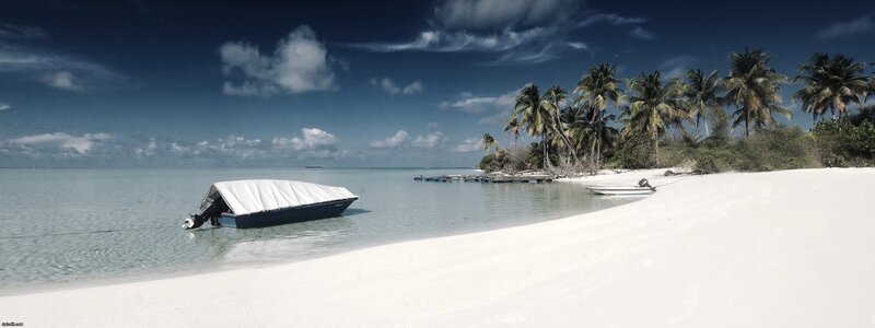 tropical beach with boat