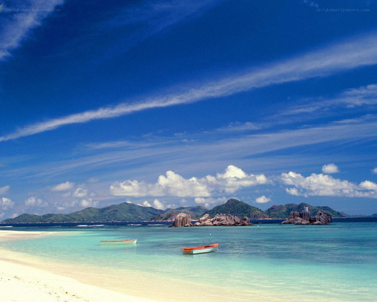 tropical beach with boats