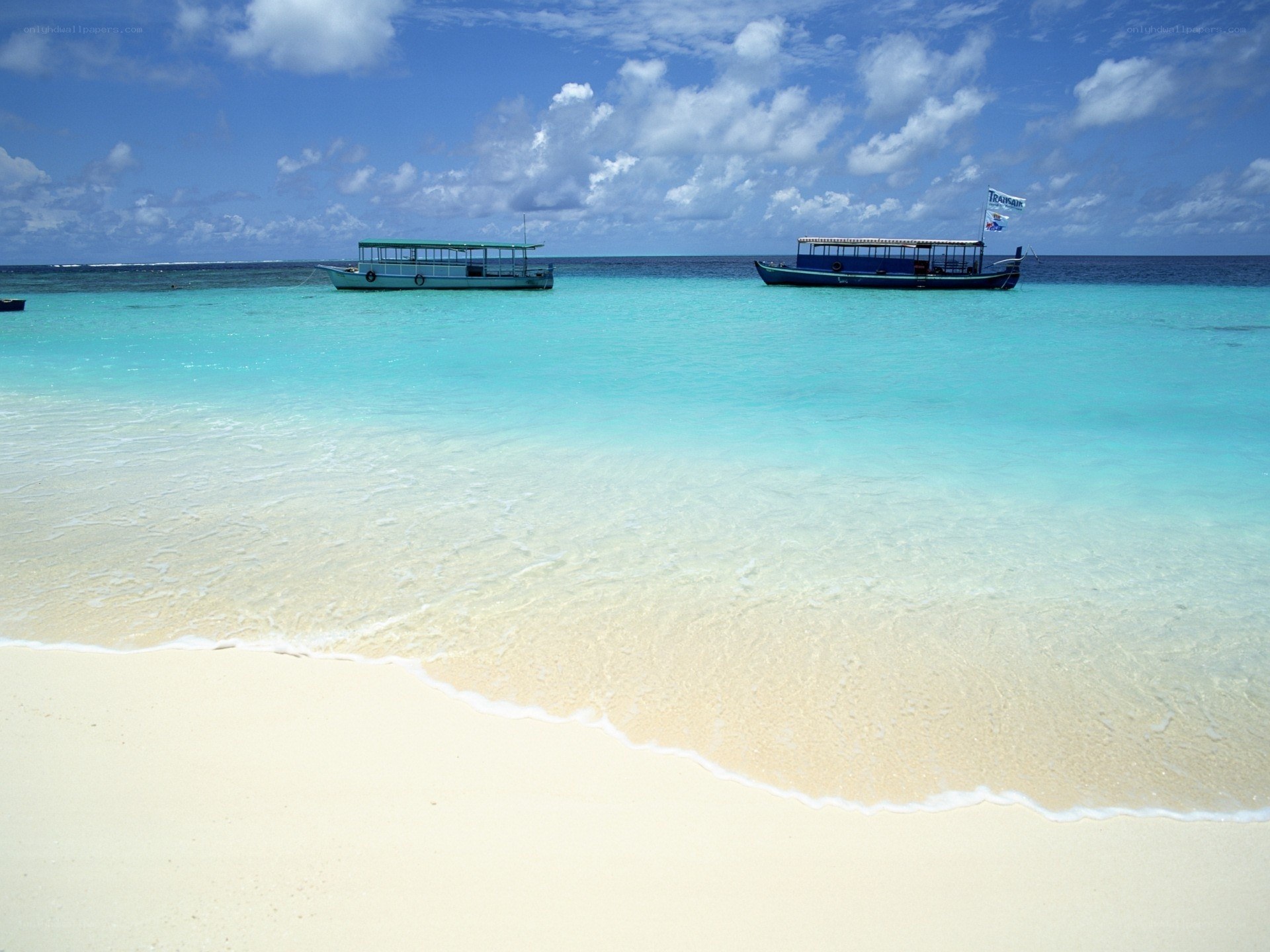 tropical beach with boats