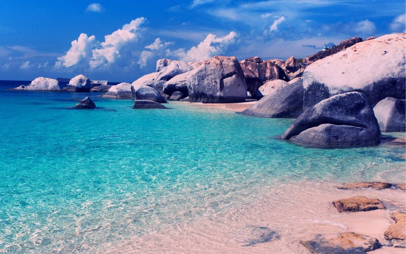 Tropical Beach with Boulders — Blue, Serene, Afternoon, Photograph, Rocks