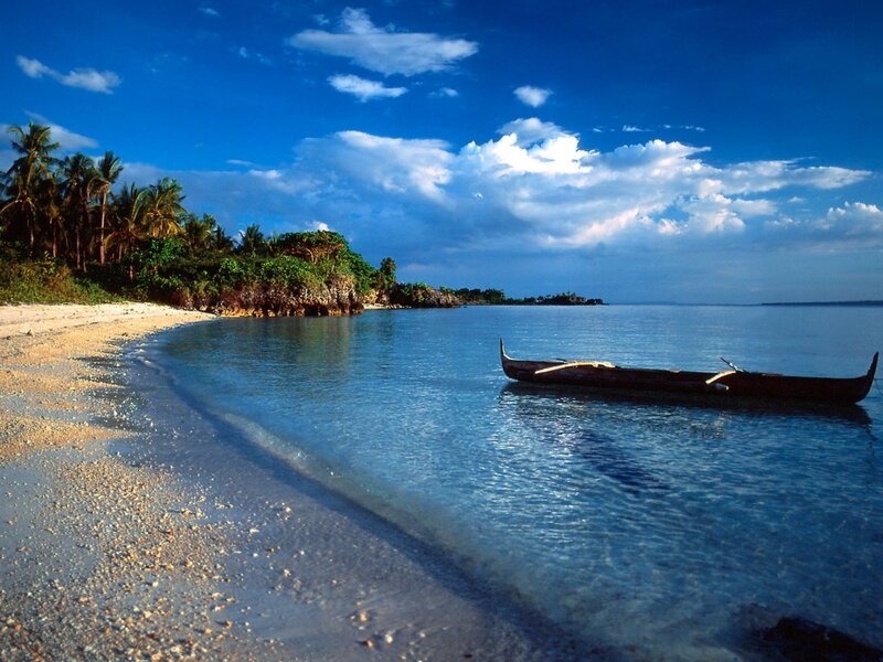tropical beach with canoe