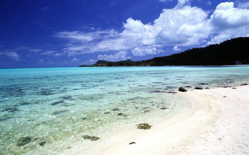 Tropical Beach with Clear Water — Blue, Serene, Afternoon, Photograph, Sand