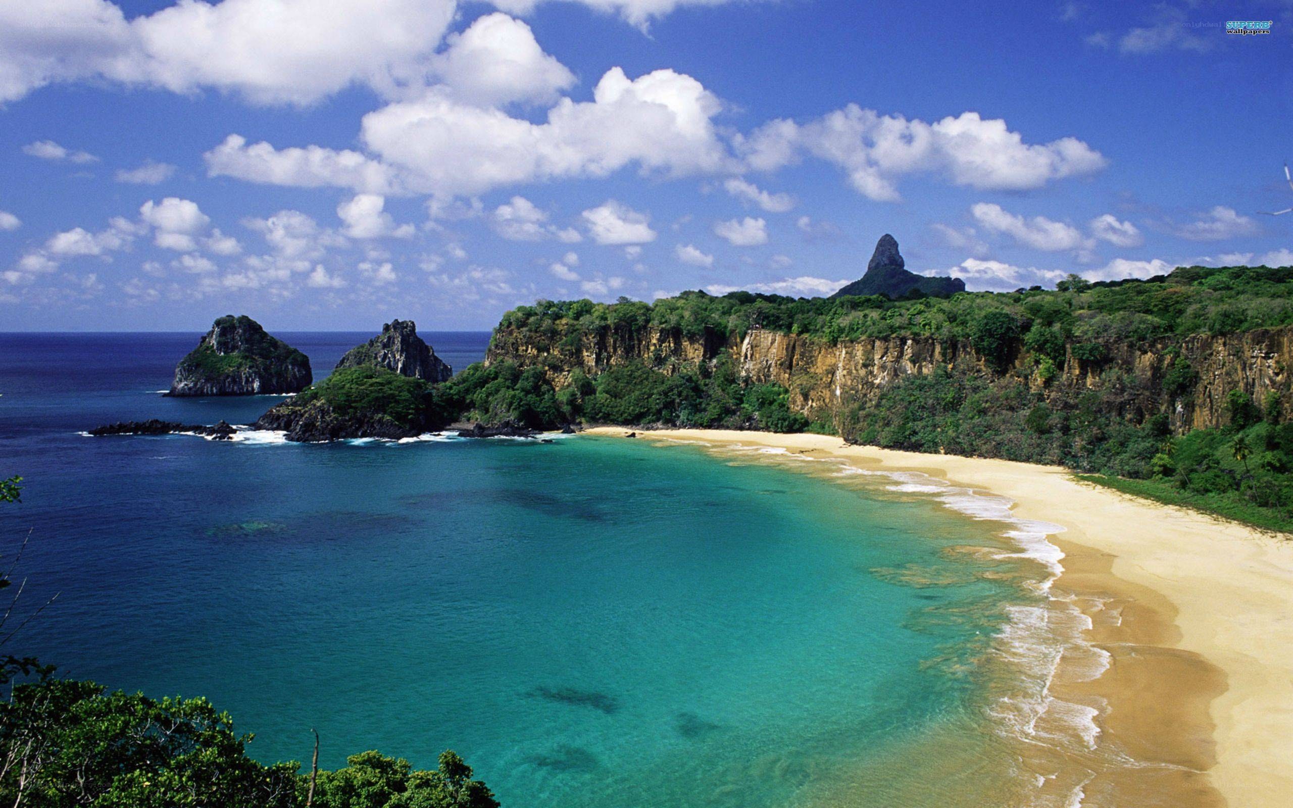 tropical beach with cliffs and sea