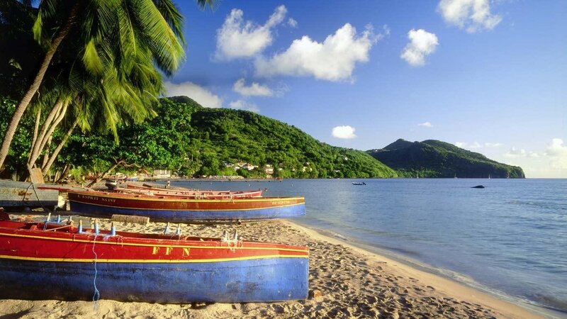 tropical beach with colorful boats