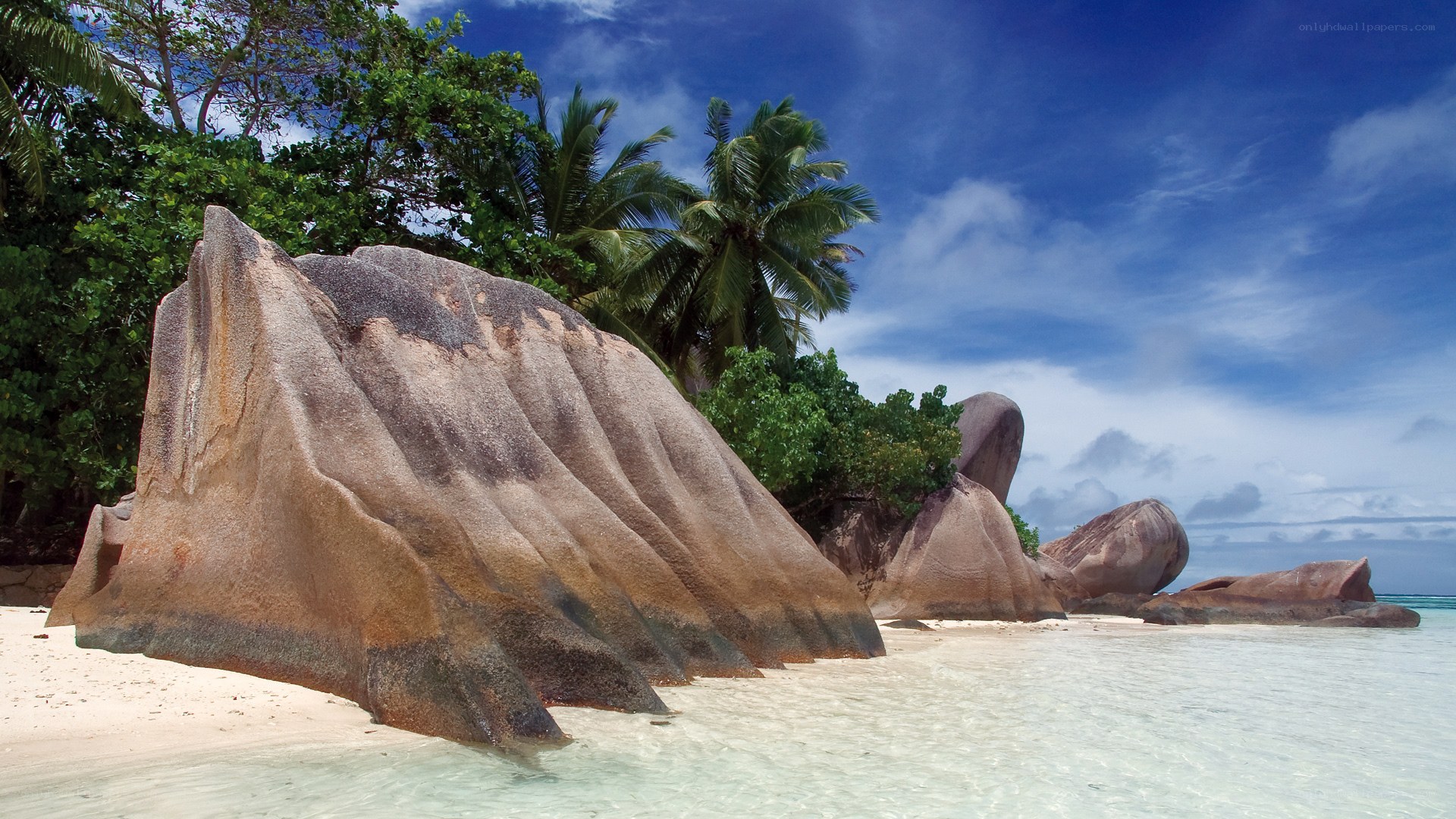 tropical beach with giant rocks