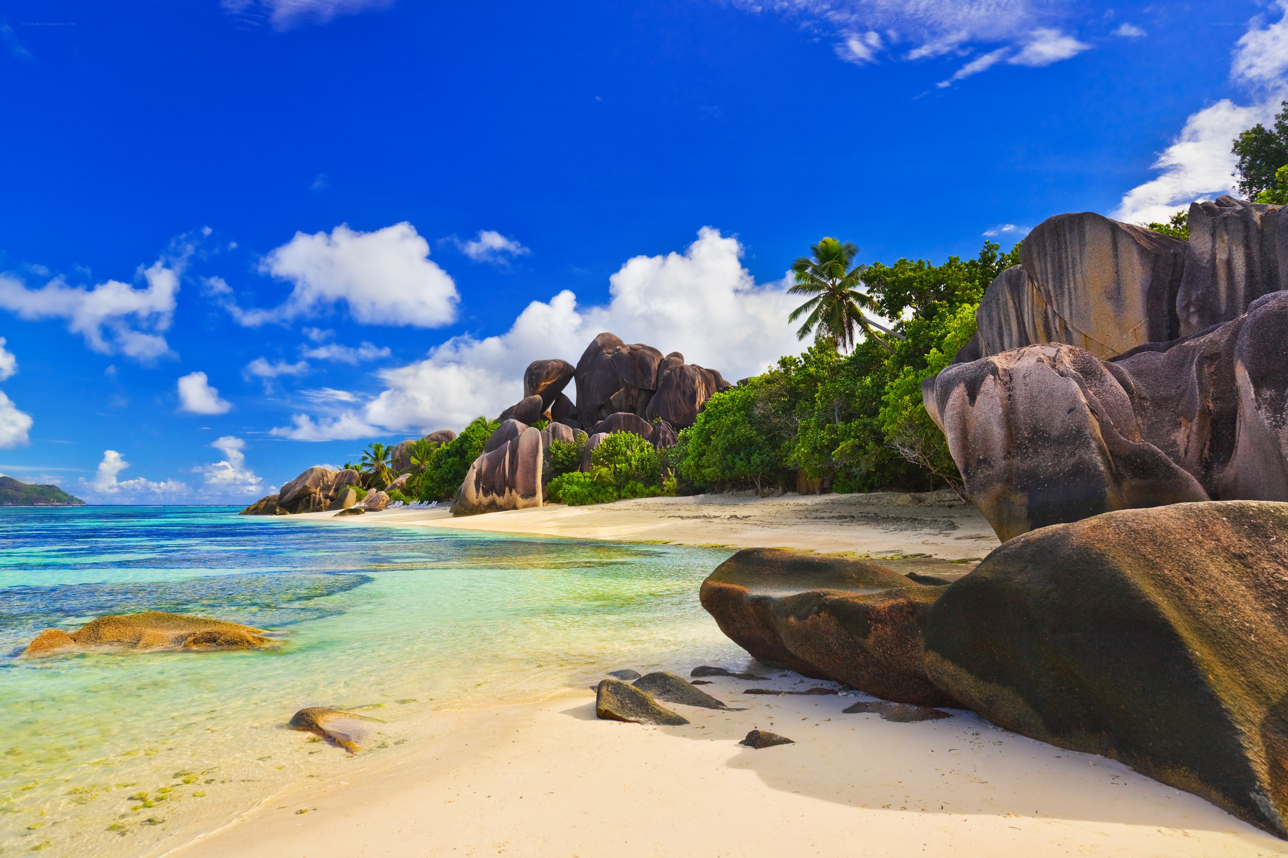 tropical beach with giant rocks