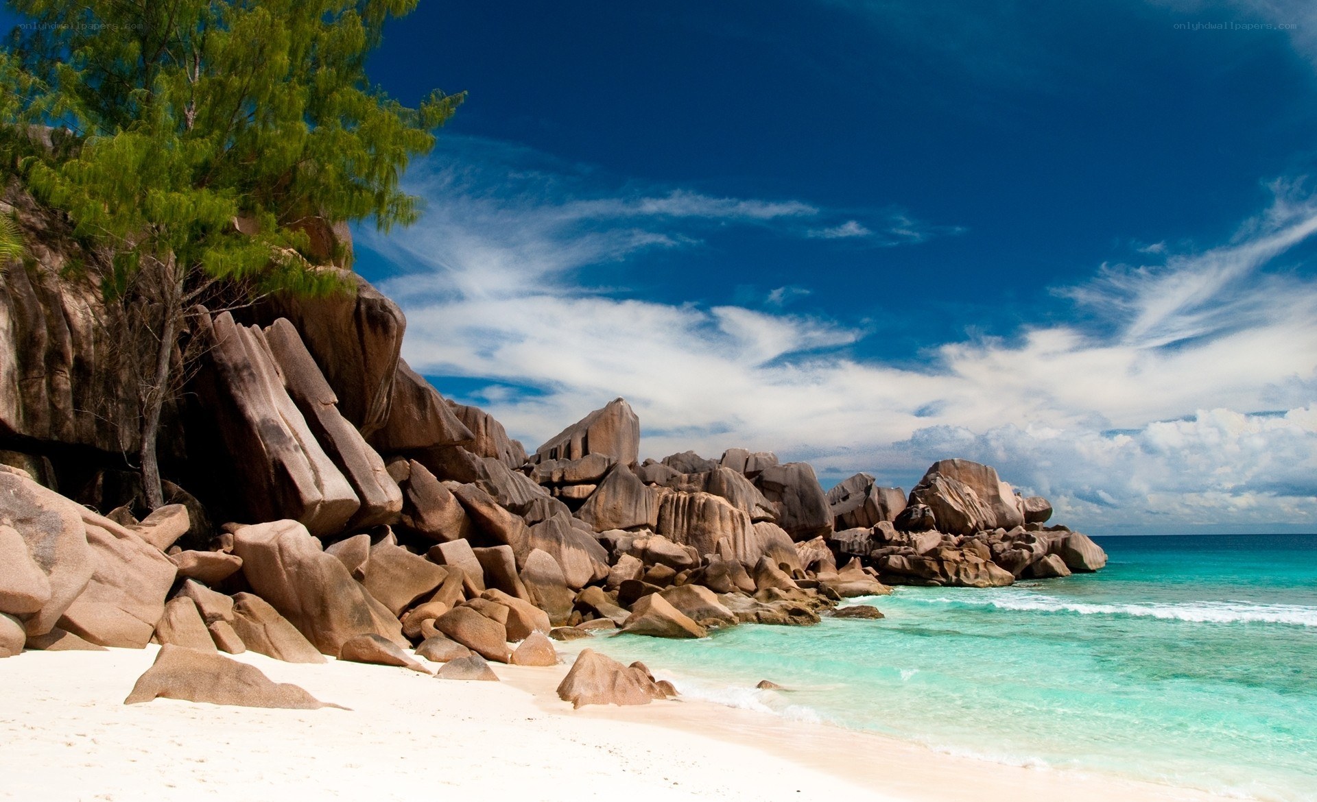 tropical beach with giant rocks