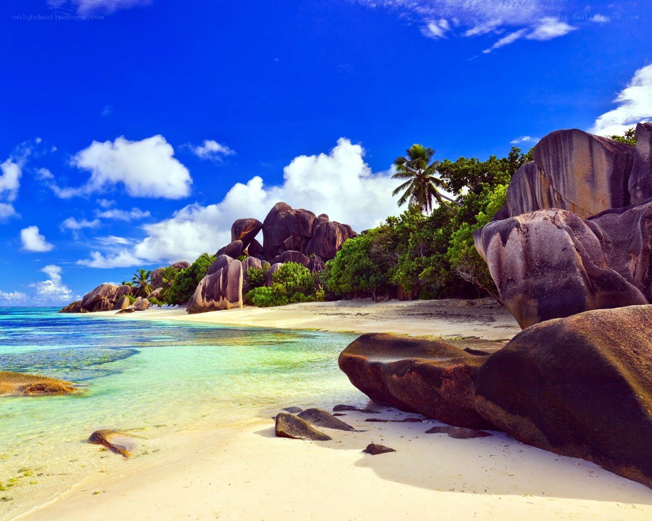 tropical beach with giant rocks