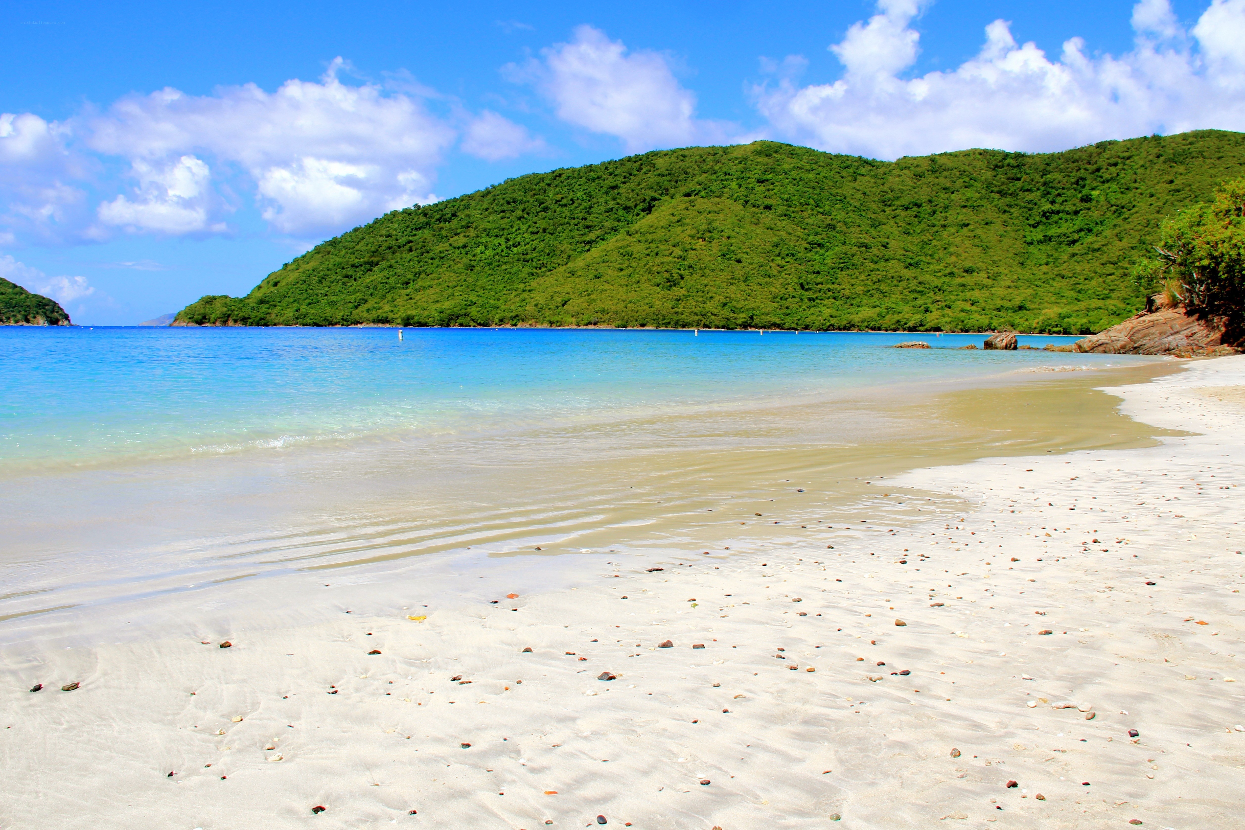 tropical beach with green hills