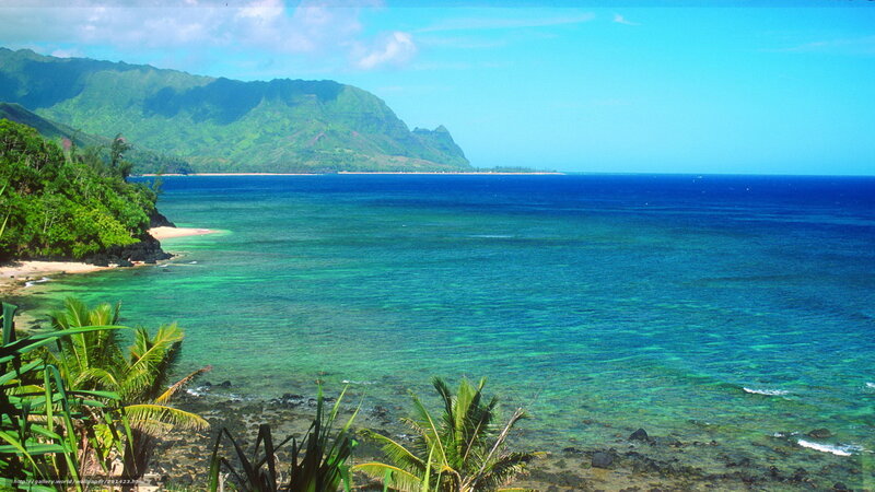 tropical beach with green mountains