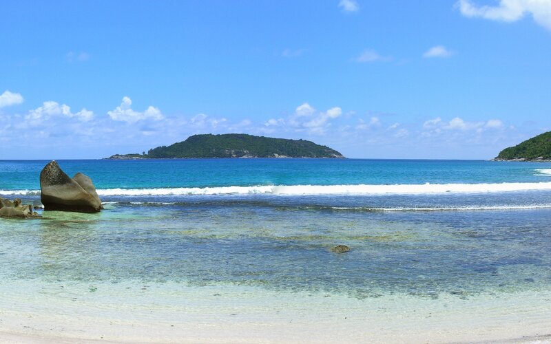 tropical beach with island view