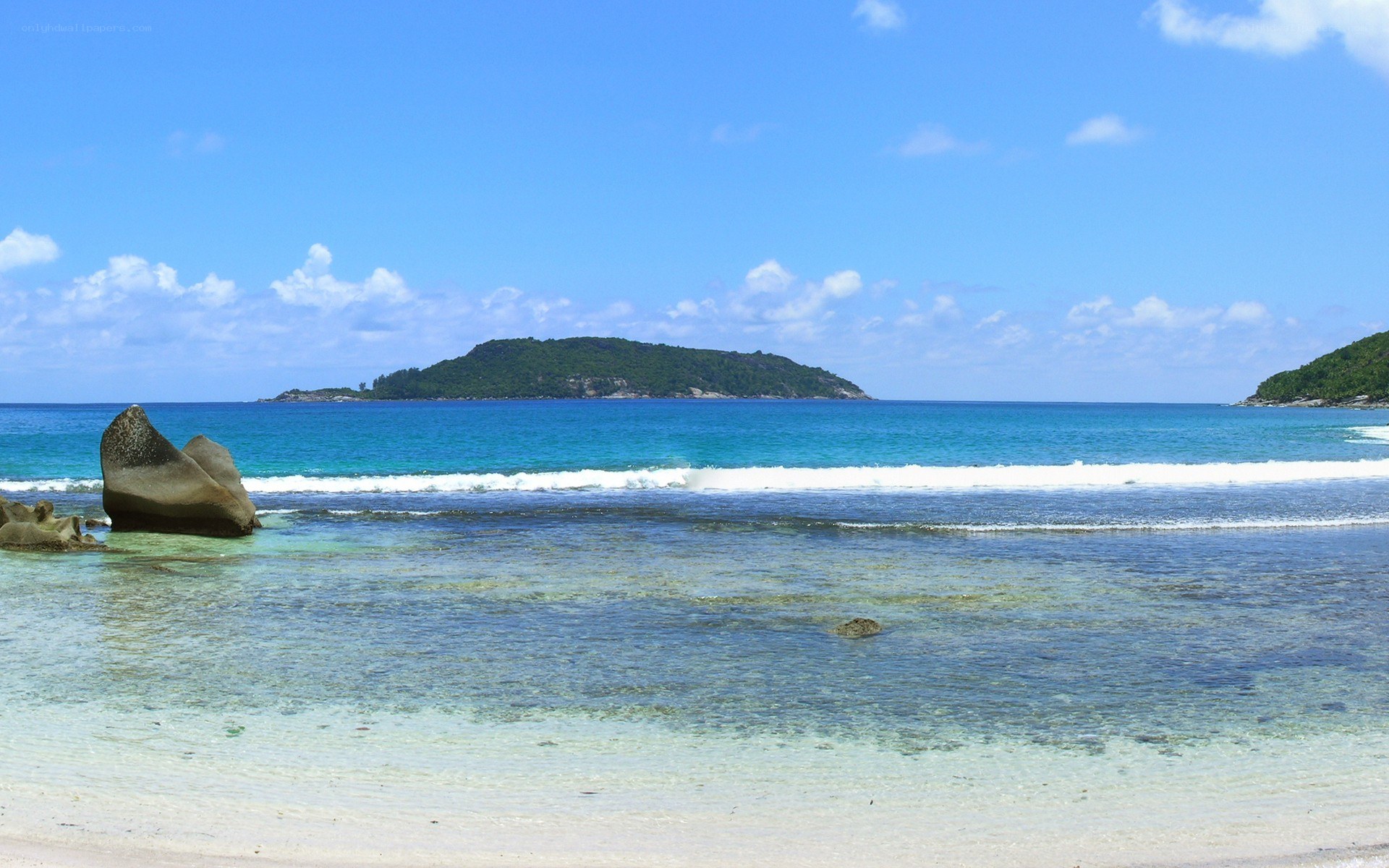 tropical beach with island view
