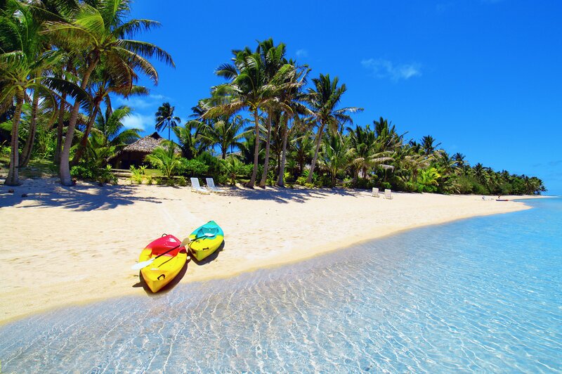 tropical beach with kayaks