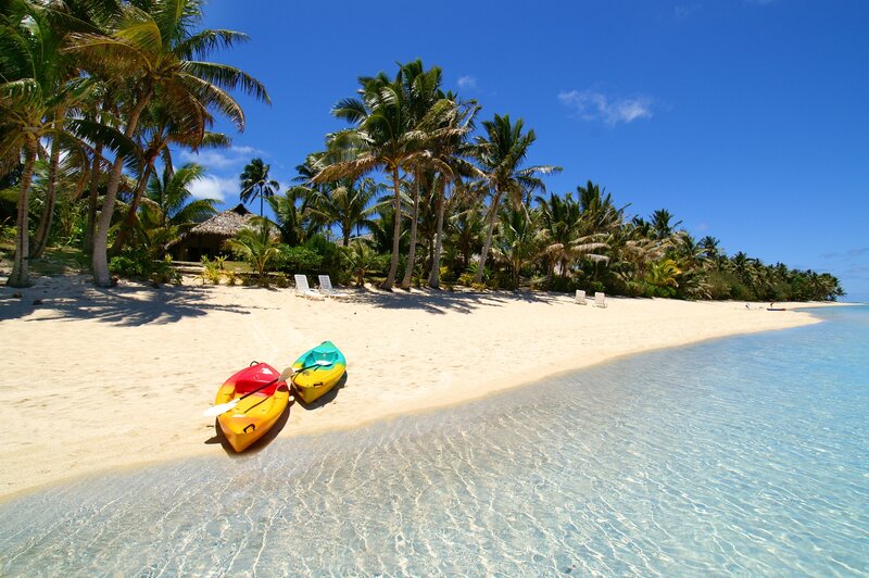 tropical beach with kayaks