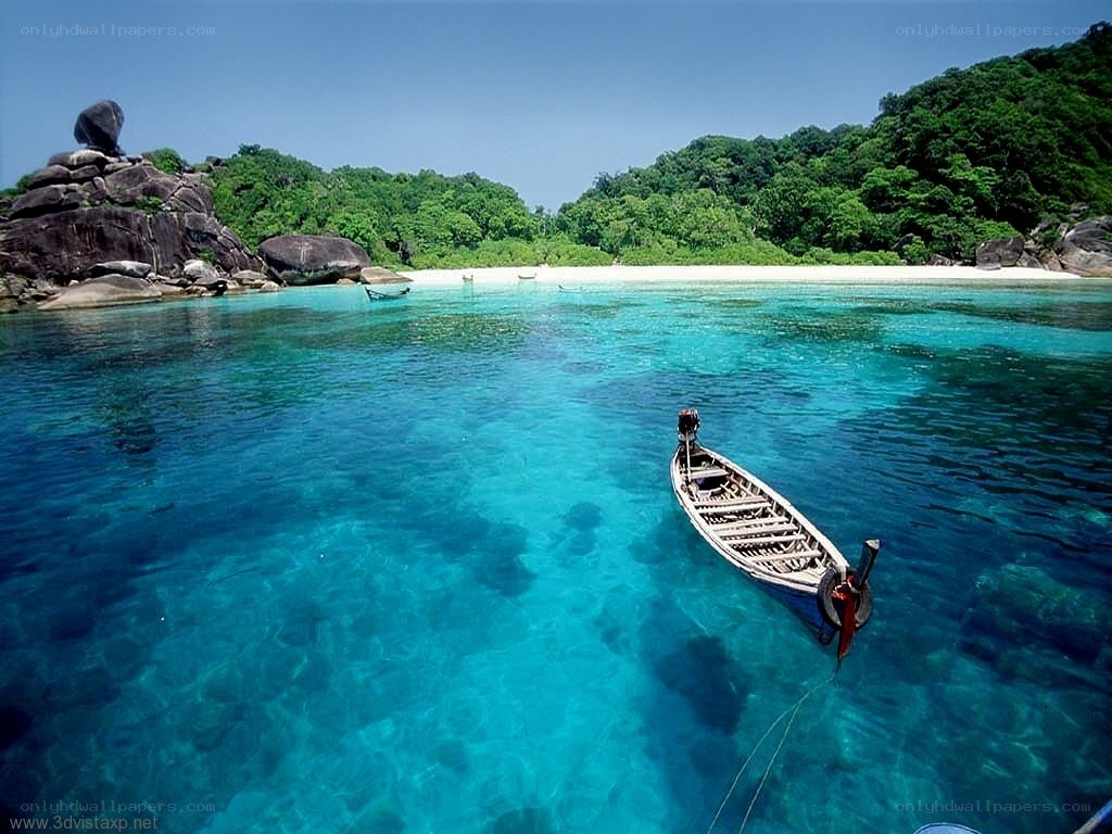 tropical beach with longtail boat