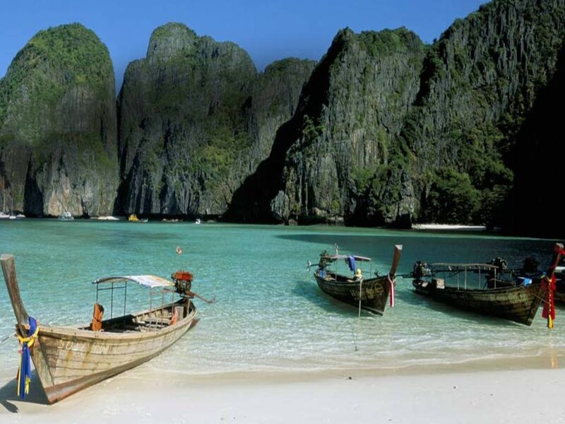 tropical beach with longtail boats