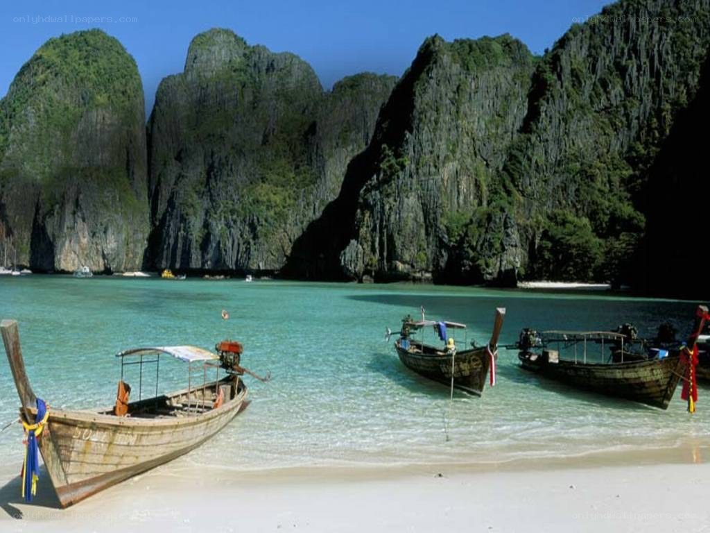 tropical beach with longtail boats
