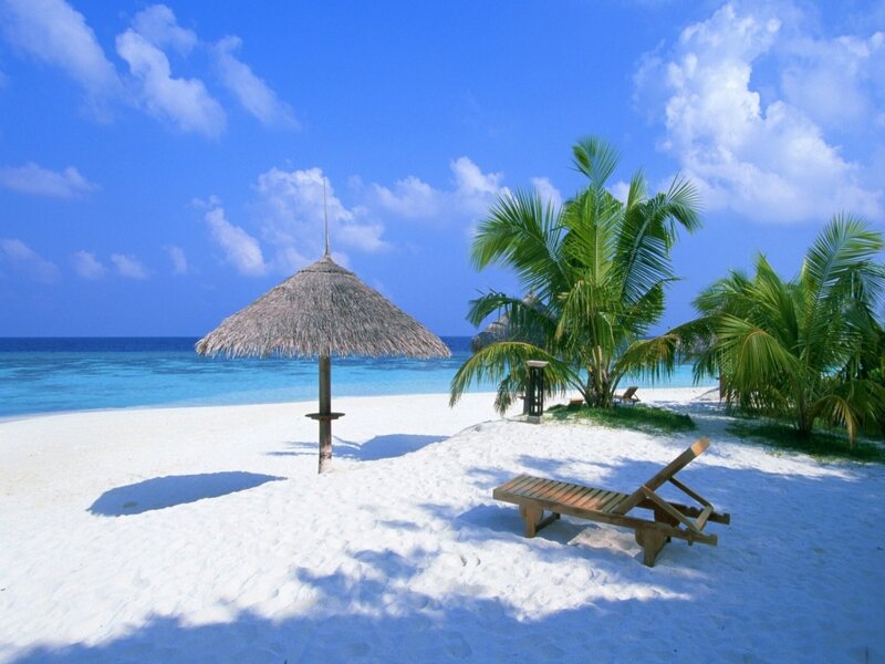 tropical beach with lounge chair