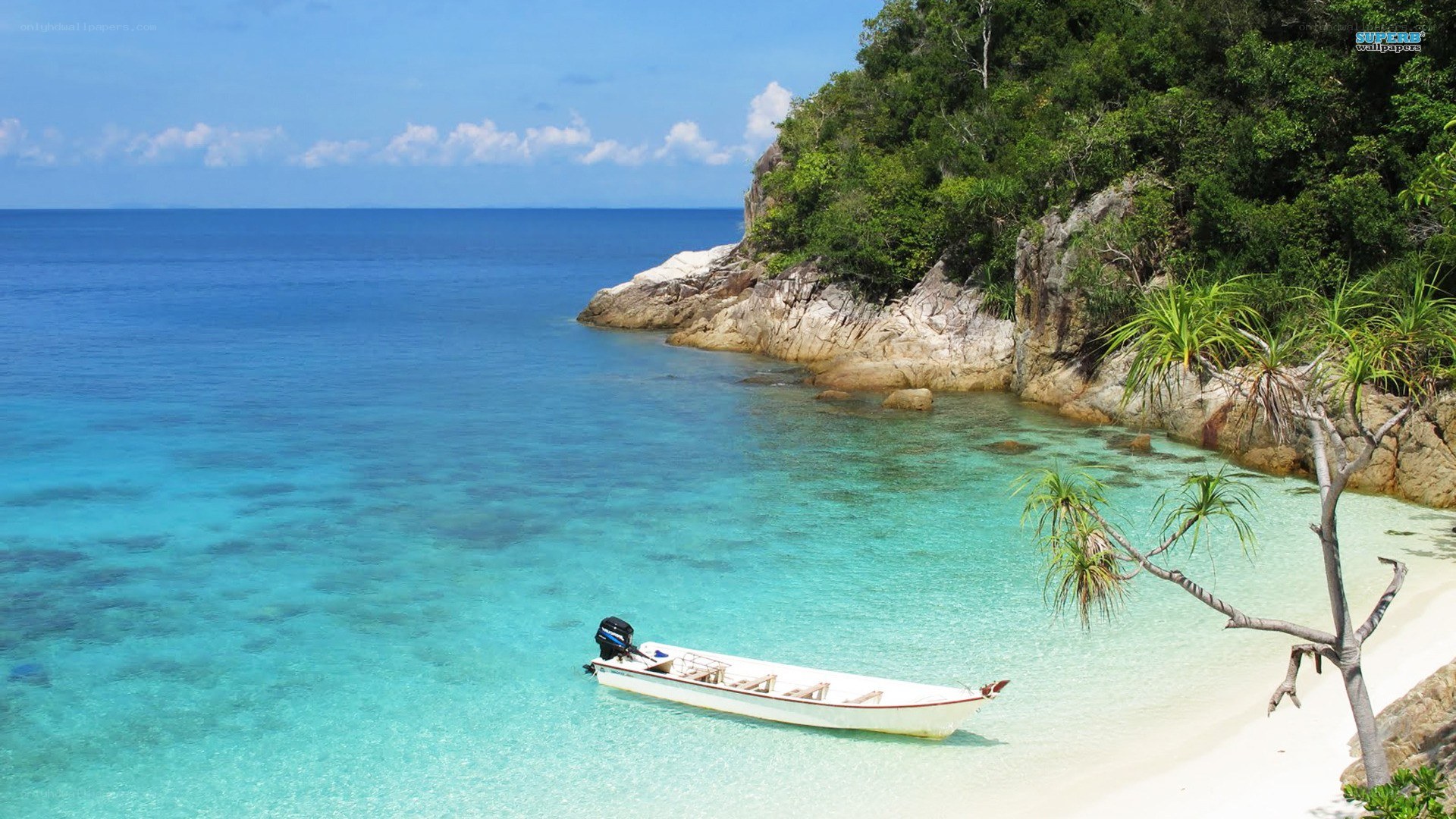 tropical beach with motorboat