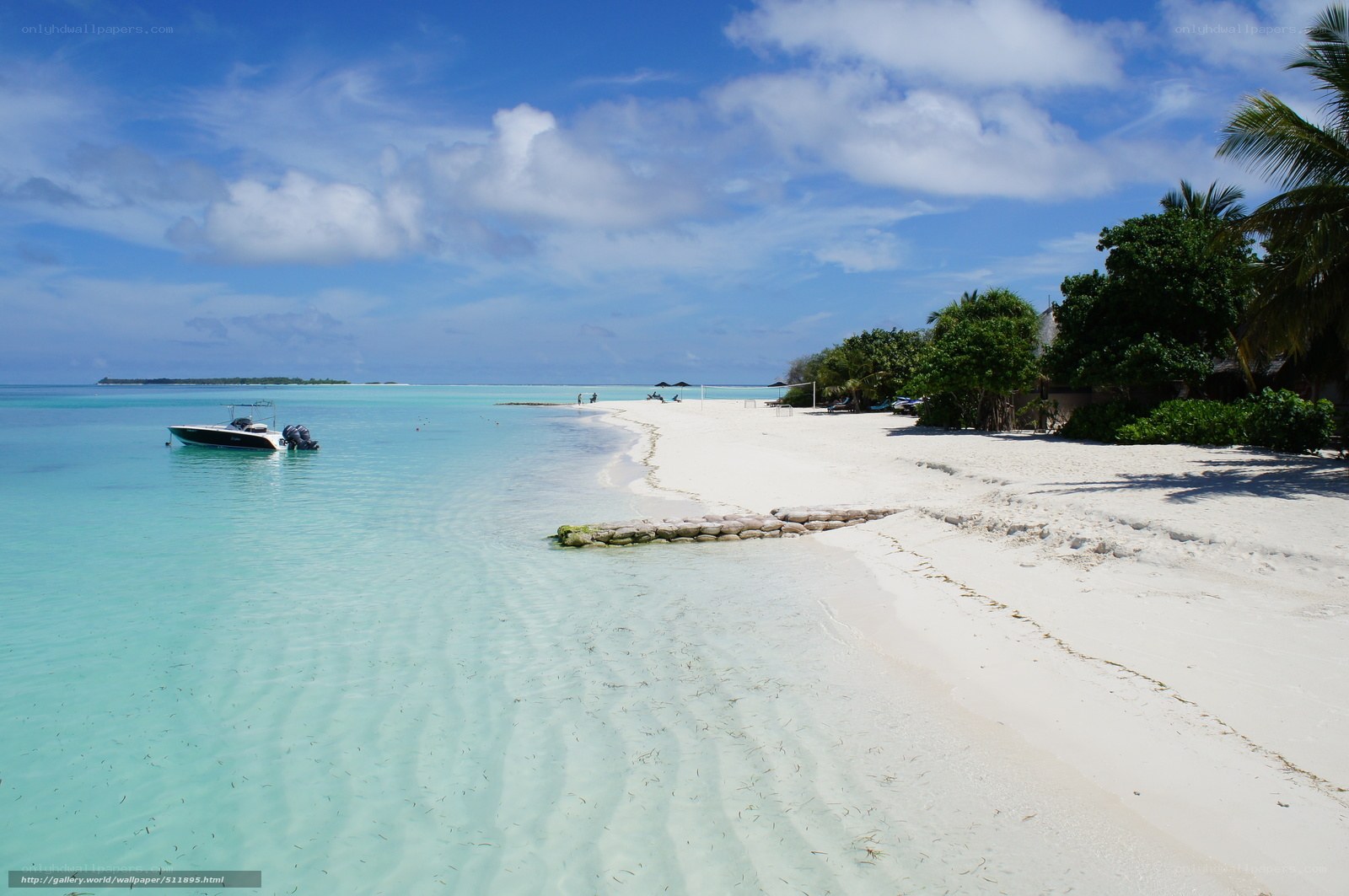 tropical beach with motorboat