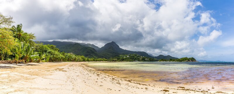 Tropical Beach with Mountains — Blue, Serene, Afternoon, Photograph, Palm Trees, Ocean