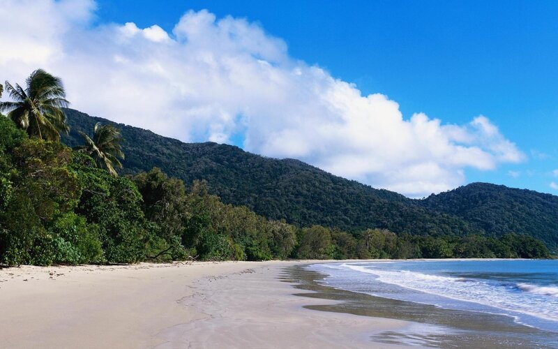 Tropical Beach with Mountains — Blue, Serene, Afternoon, Photograph, Palm Trees, Ocean Waves, Clouds