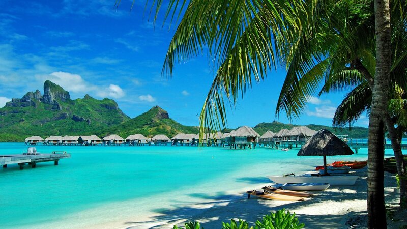 Tropical beach with overwater bungalows