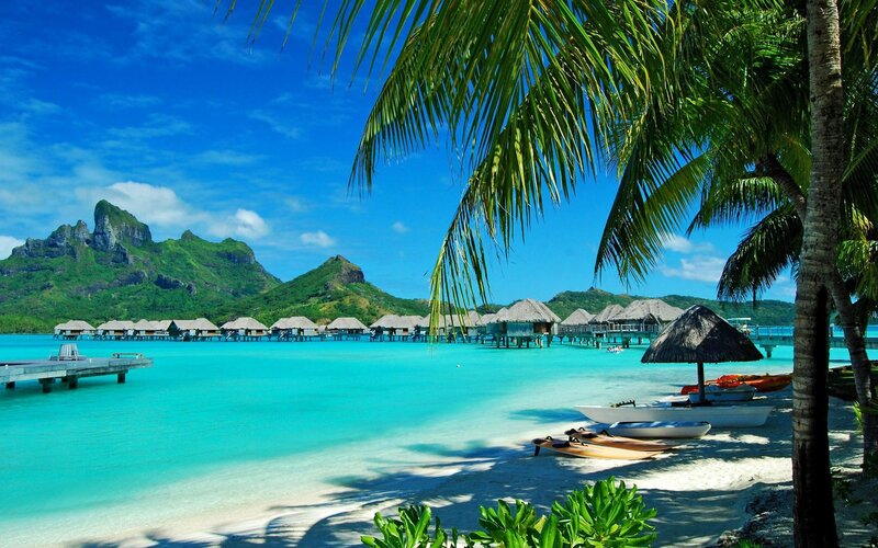 tropical beach with overwater bungalows