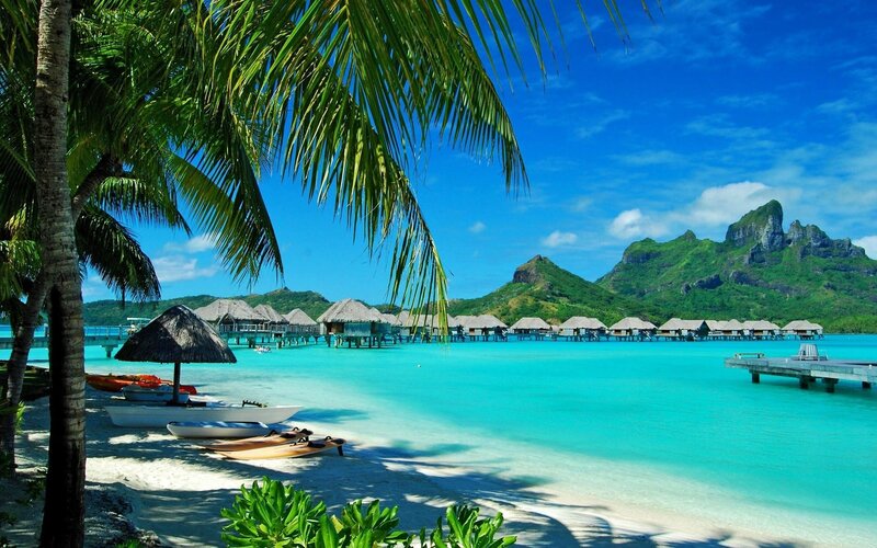 tropical beach with overwater bungalows