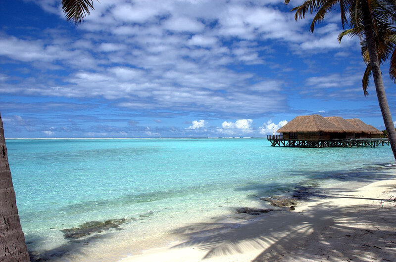 Tropical beach with overwater bungalows