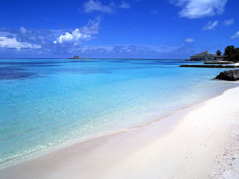 Tropical Beach with Pier — Blue, Serene, Afternoon, Photograph, Building