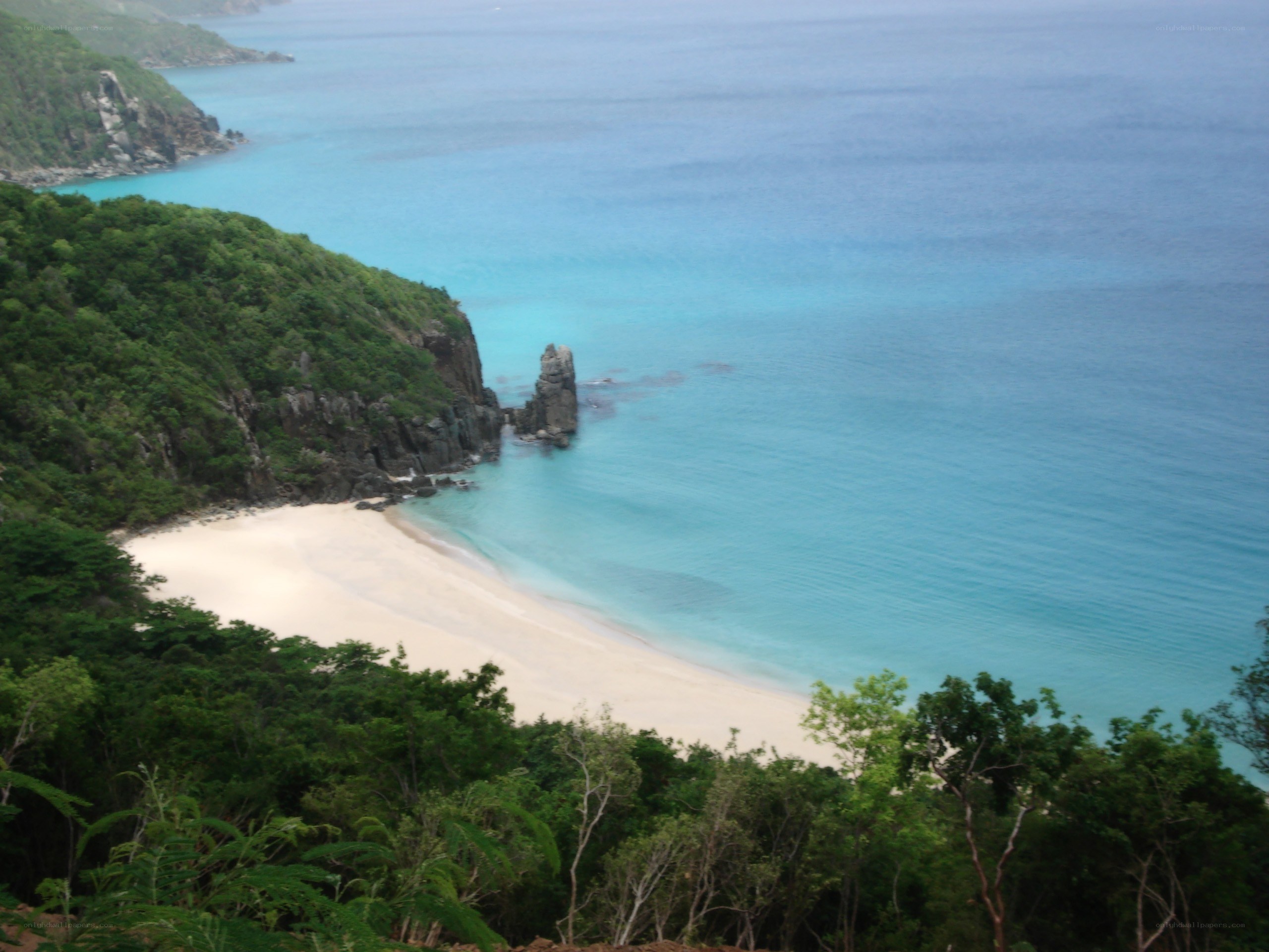 tropical beach with rock formation