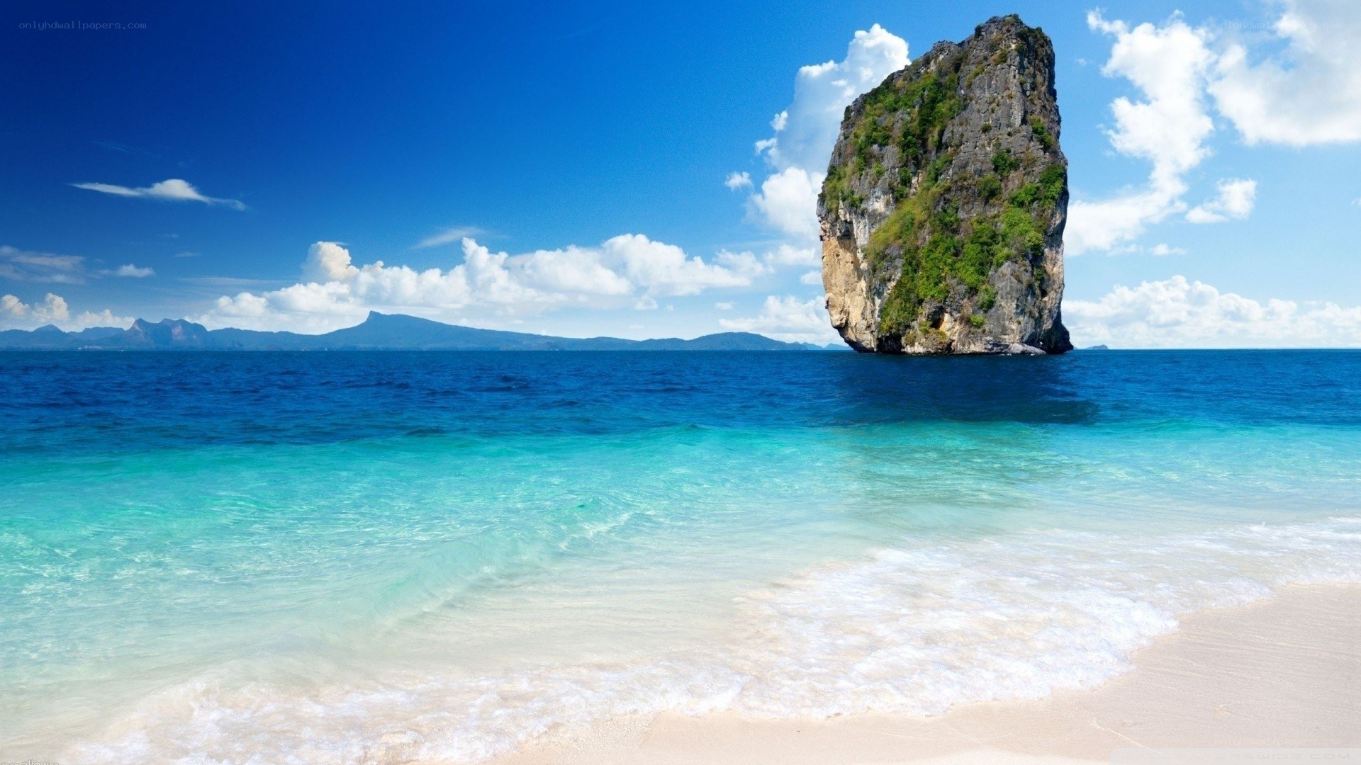 tropical beach with rock formation