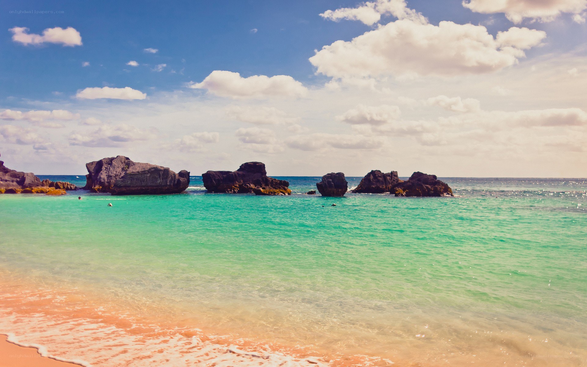 tropical beach with rock formations