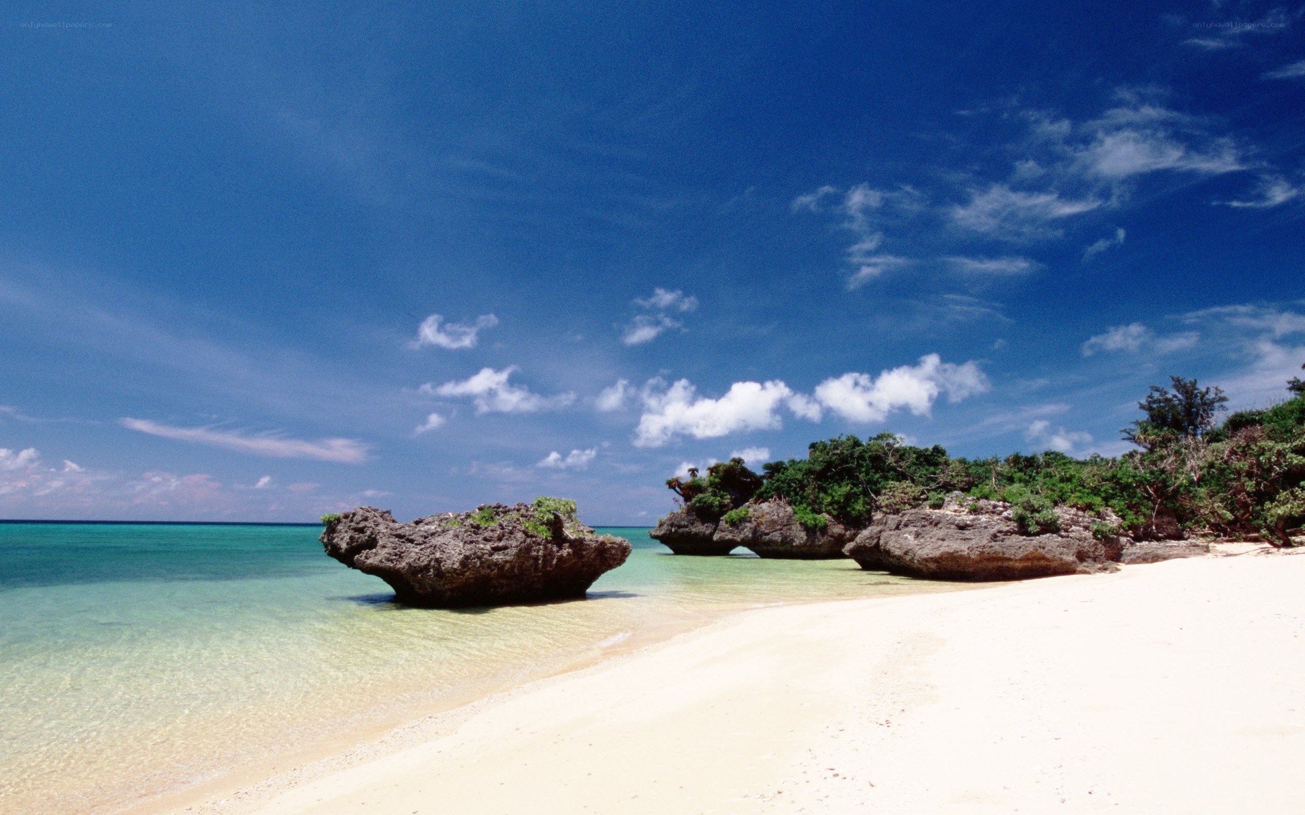 tropical beach with rock formations
