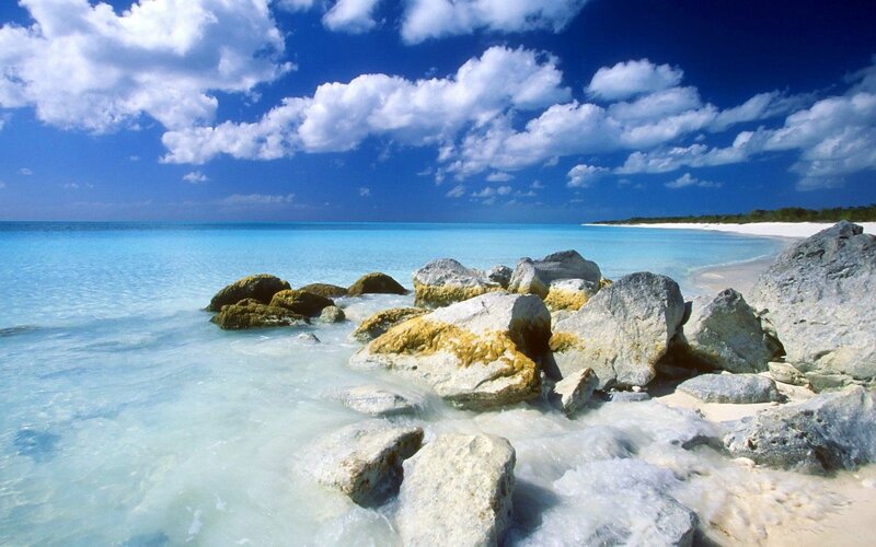 tropical beach with rocks and turquoise water