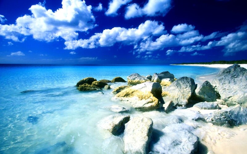 Tropical Beach with Rocks — Blue, Serene, Afternoon, Photograph, Ocean, Clouds, Sand