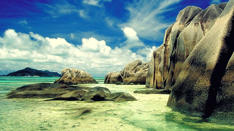 Tropical Beach with Rocks — Blue, Serene, Afternoon, Photograph, Ocean, Sky, Clouds