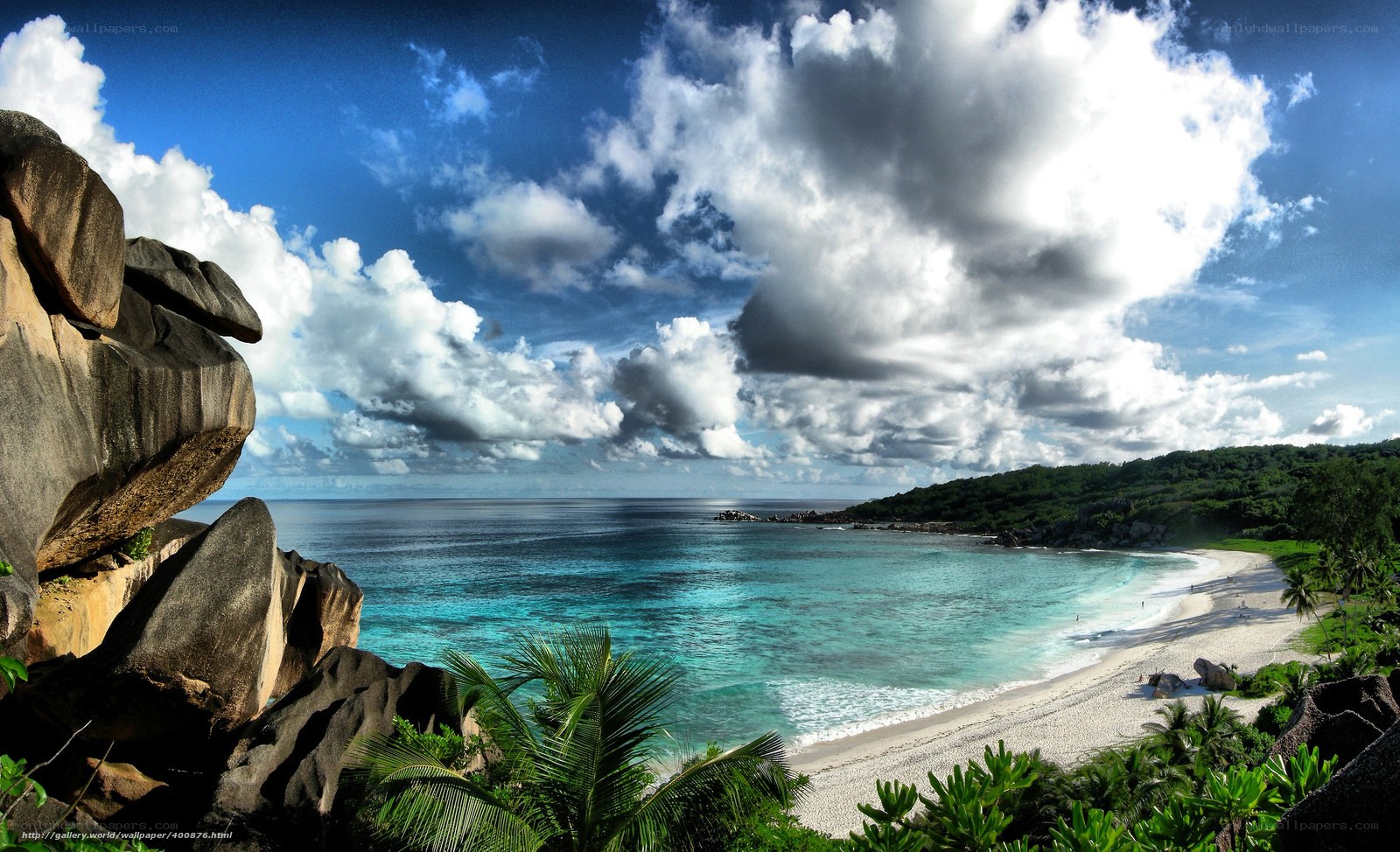 tropical beach with rocky cliffs