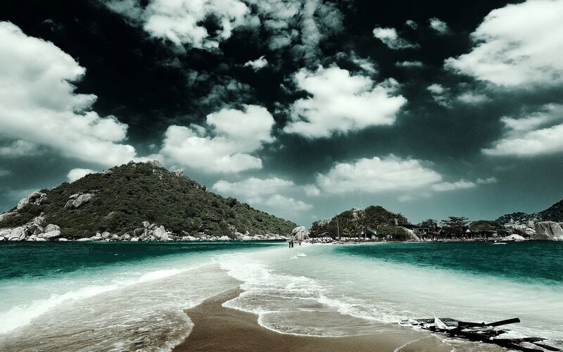 tropical beach with rocky island