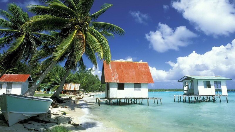 Tropical beach with stilt houses