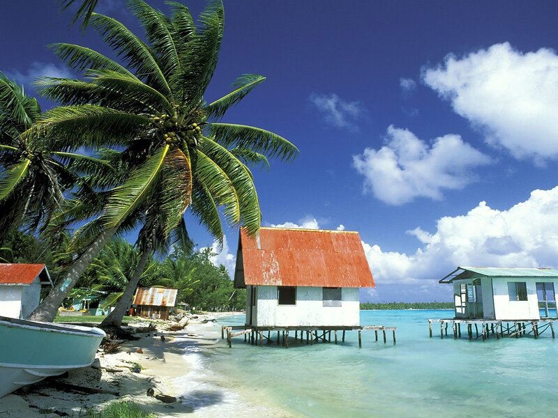 Tropical beach with stilt houses