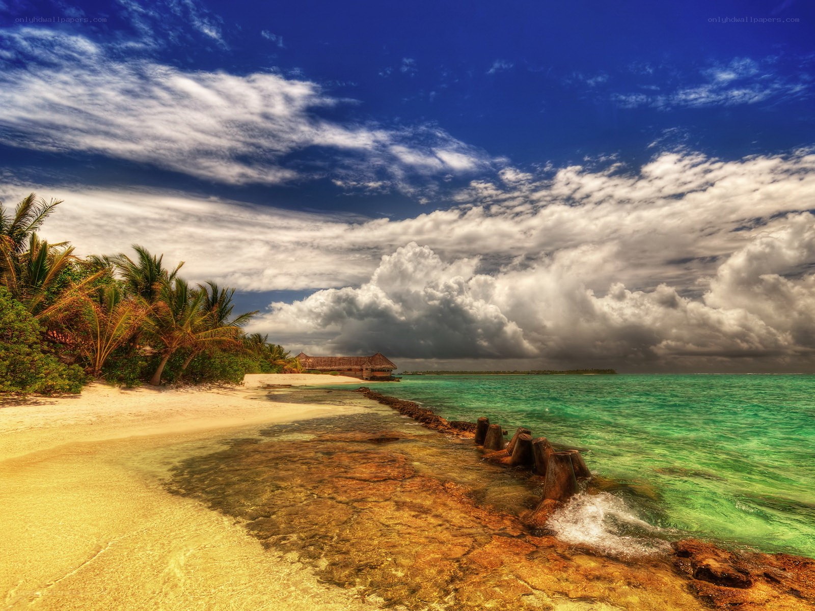tropical beach with storm clouds