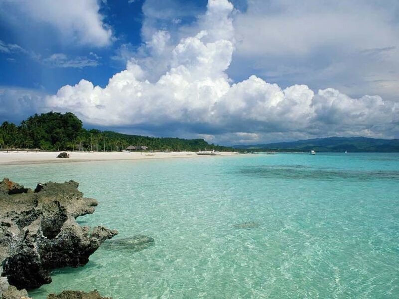 Tropical Beach with Turquoise Water — Blue, Serene, Afternoon, Photograph, Sand, Trees, Clouds