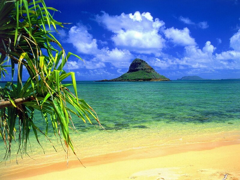 tropical beach with volcanic island