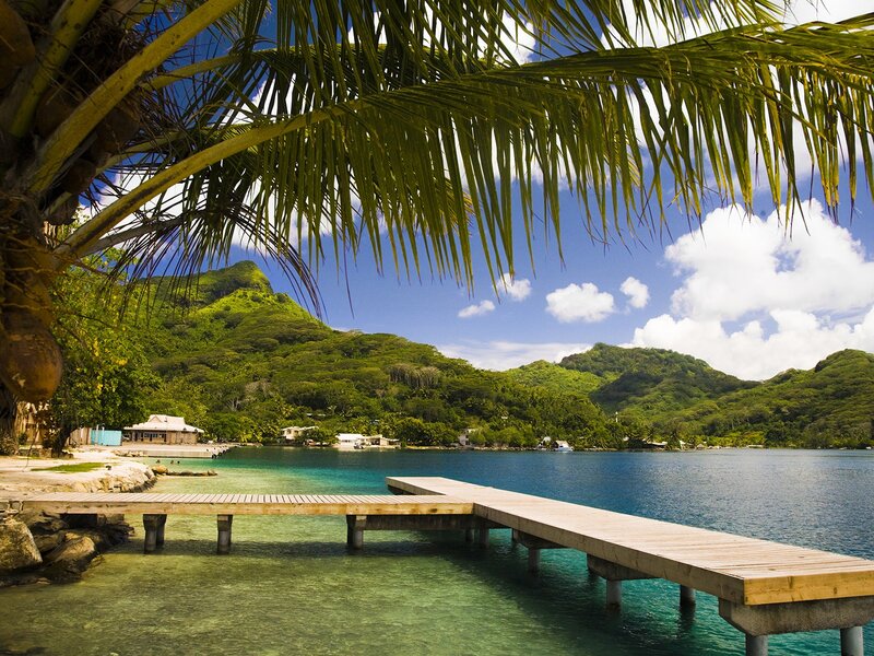 tropical beach with wooden dock