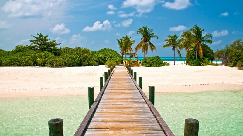 tropical beach with wooden pier
