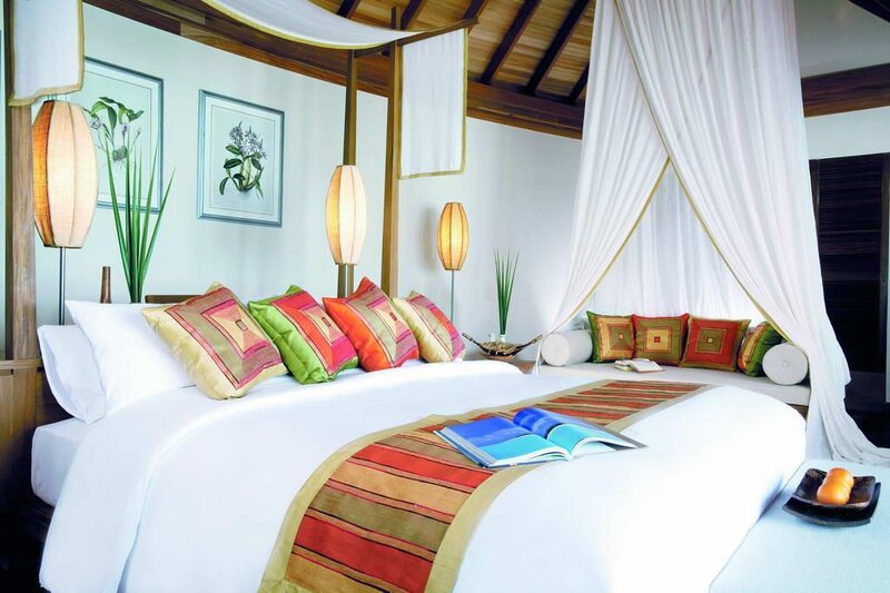 tropical bedroom with canopy bed