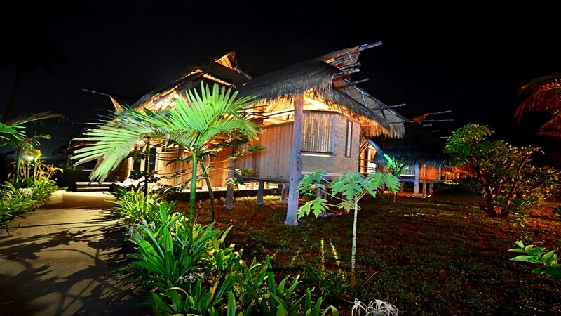 tropical bungalows at night