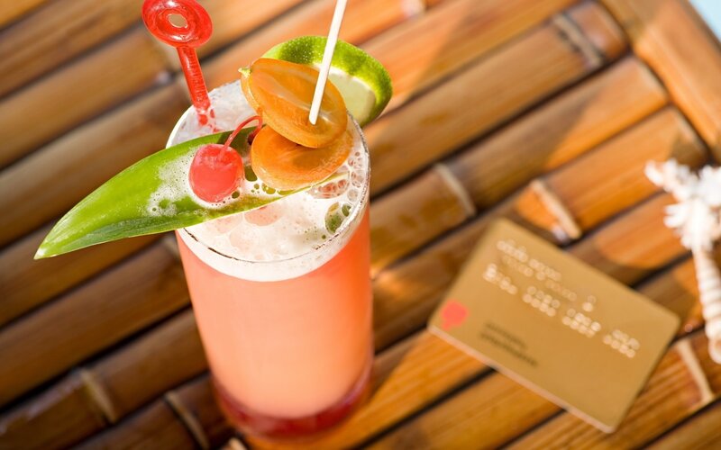 tropical cocktail with credit card